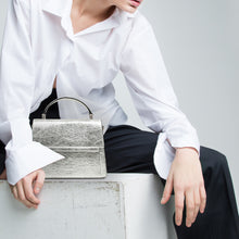 Load image into Gallery viewer, Model with Fire Flap Cross Body - Silver - Vegan - Pinatex - Alkeme Atelier